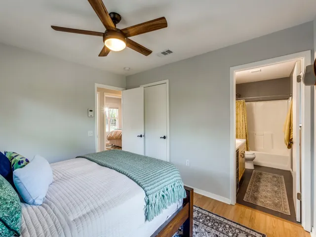 a bedroom with a bed and a walk in closet