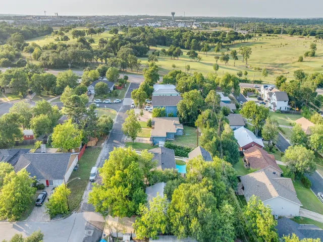 an aerial view of residential houses with outdoor space