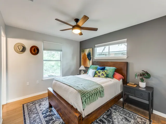 a bedroom with a bed and a window