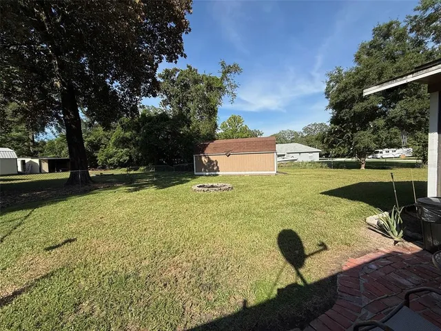 a view of a garden with lawn chairs