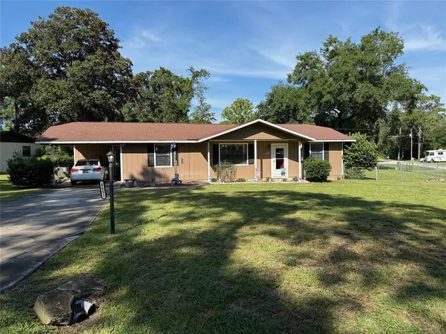 a house with swimming pool in front of it