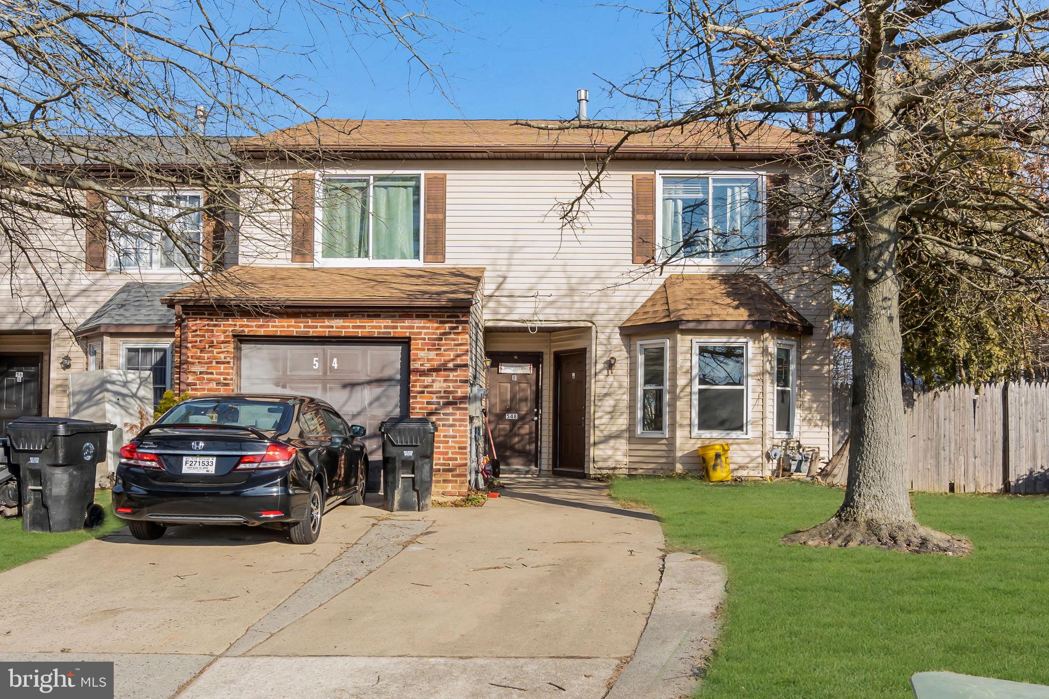 a view of a car parked in front of a house