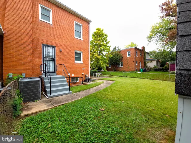 a view of a backyard with sitting area