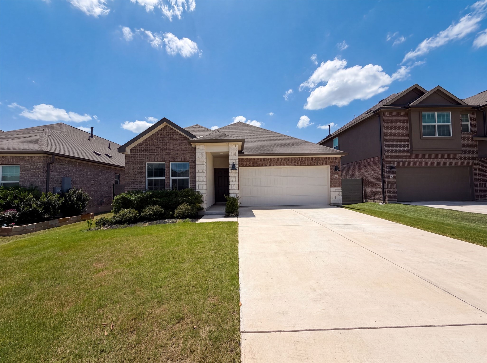 424 Wolf Springs Road Georgetown, TX 78628 - Photo 1 of 15 A well-maintained facade features a blend of brick and stone, creating inviting curb appeal.
