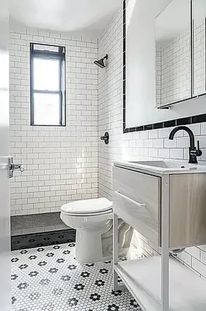 a view of a kitchen with stainless steel appliances a refrigerator and a stove
