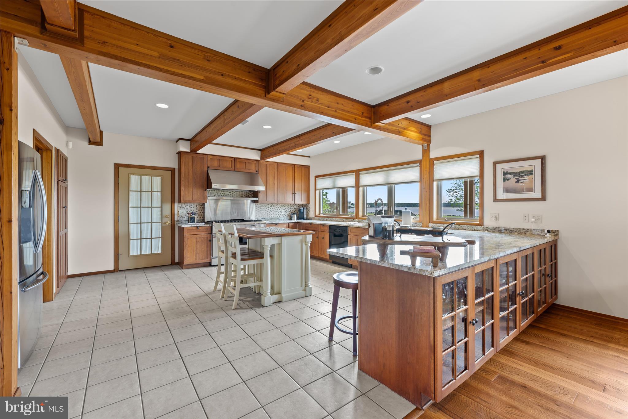 4808 Saltmarsh Lane Madison, MD 21648 - Photo 26 of 119 a open kitchen with stainless steel appliances granite countertop a stove and a cabinets