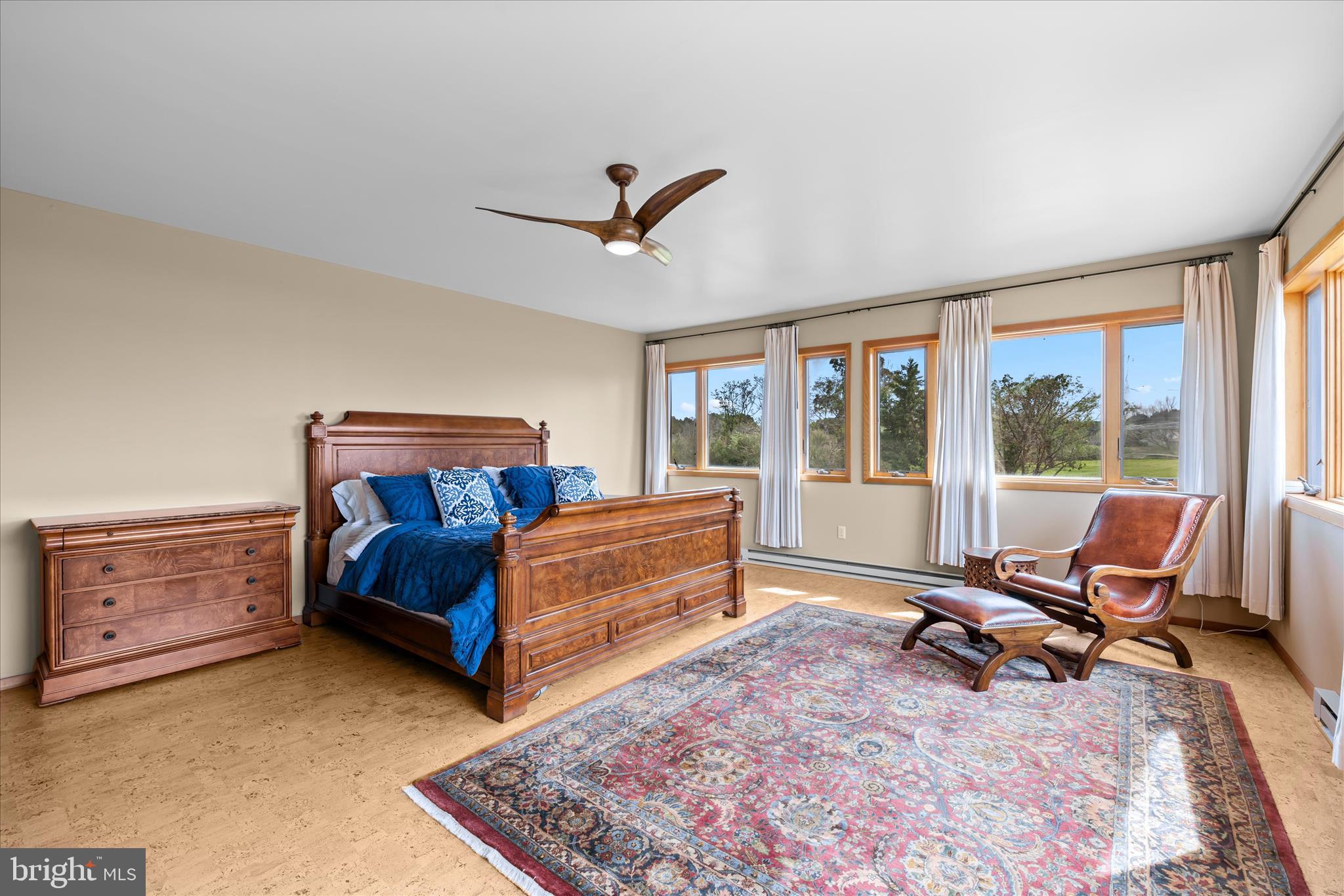4808 Saltmarsh Lane Madison, MD 21648 - Photo 49 of 119 a bedroom with a bed and wooden floor