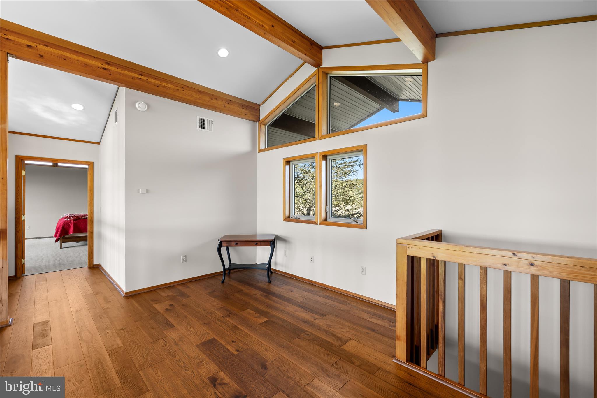 4808 Saltmarsh Lane Madison, MD 21648 - Photo 54 of 119 a view of an empty room with wooden floor and a window