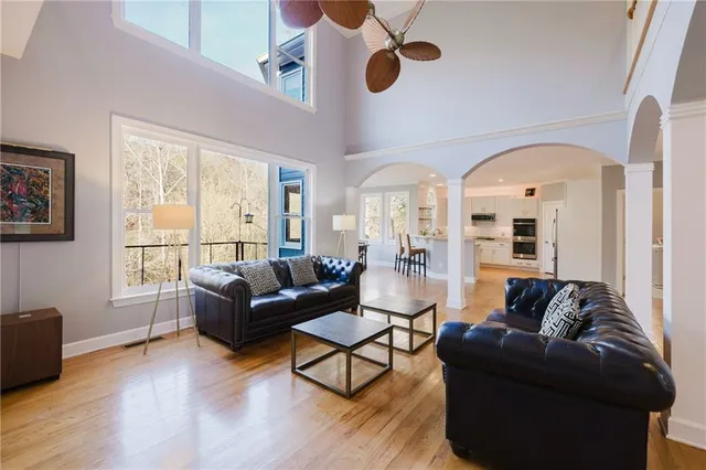 a view of kitchen with granite countertop cabinets and refrigerator