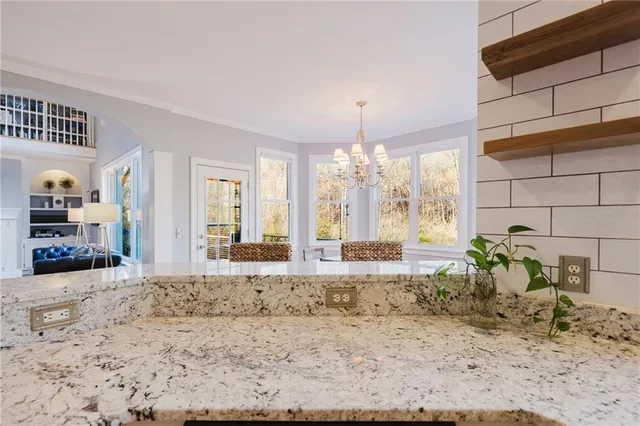 a view of a living room and dining room