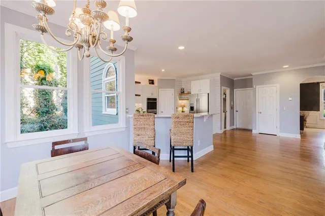 a bathroom with bathtub and window
