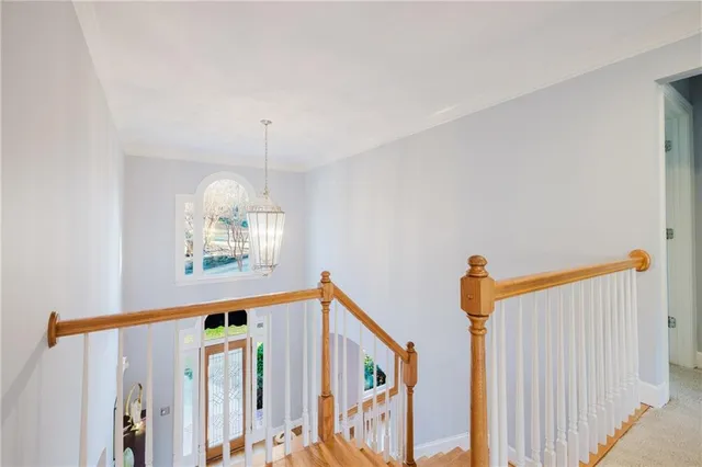 a bathroom with a bathtub shower sink vanity and mirror