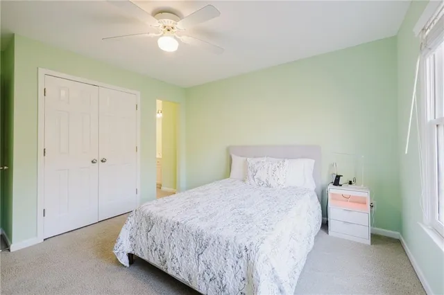 a front view of a building with a garden