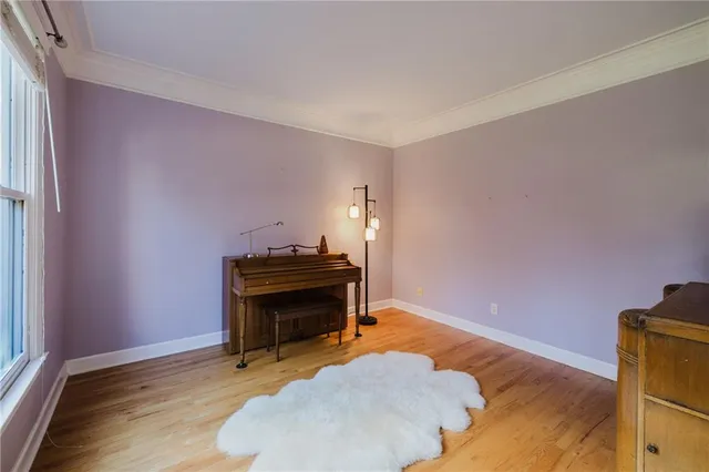 a kitchen with granite countertop a sink stainless steel appliances and white cabinets