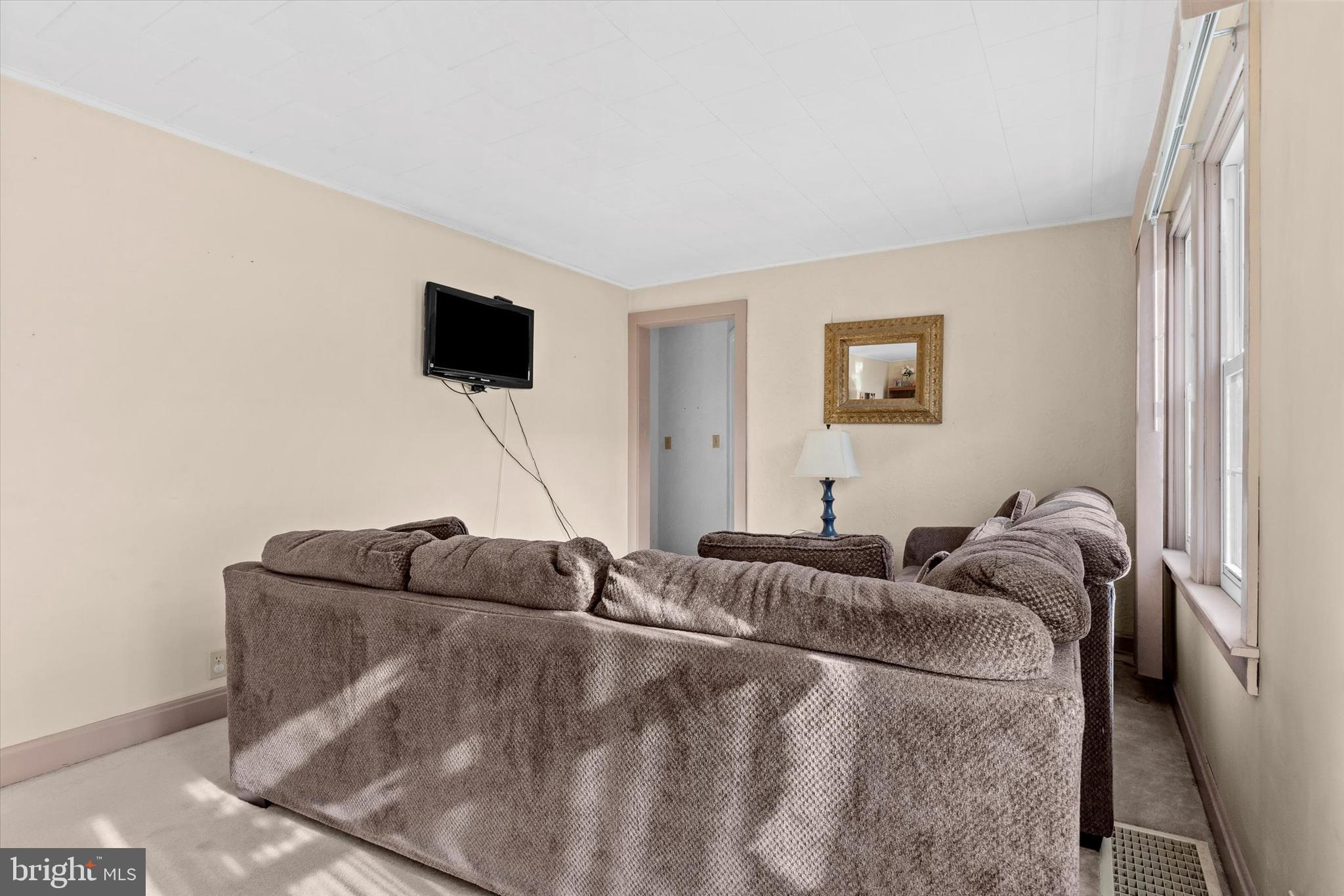 1365 Highway 209 Millersburg, PA 17061 - Photo 11 of 43 a living room with furniture and a flat screen tv