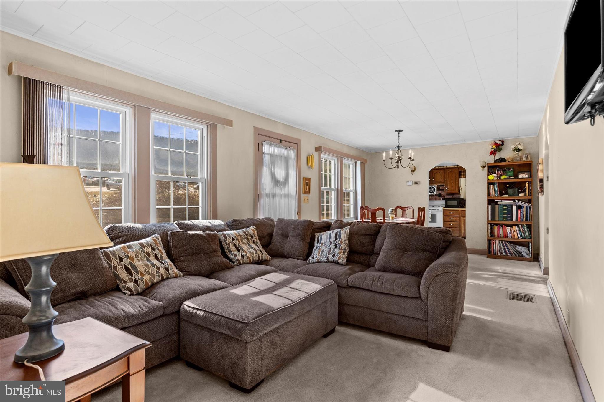 1365 Highway 209 Millersburg, PA 17061 - Photo 12 of 43 a living room with furniture and a flat screen tv