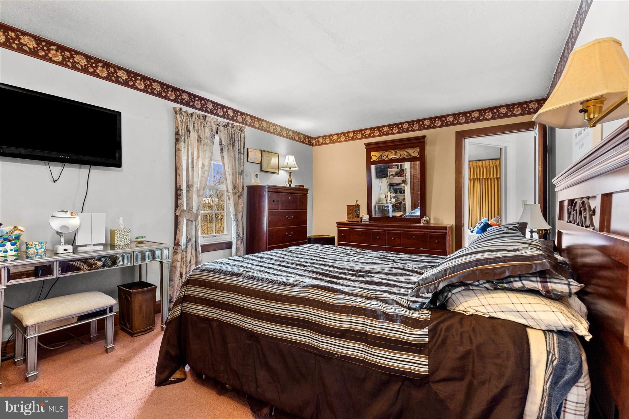 1365 Highway 209 Millersburg, PA 17061 - Photo 18 of 43 a bedroom with a bed a flat screen tv and a couch