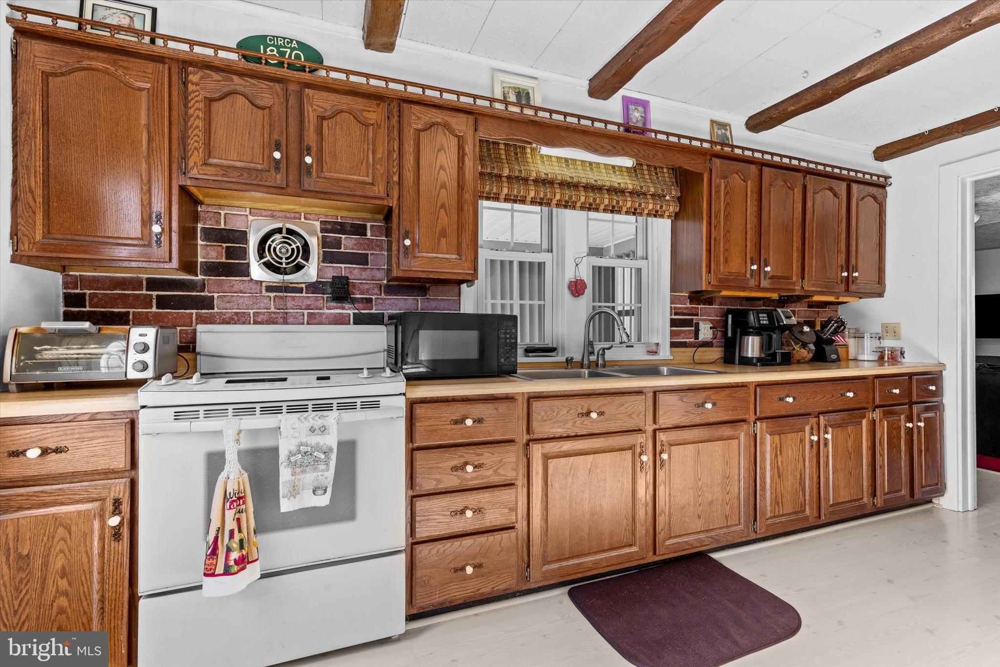 1365 Highway 209 Millersburg, PA 17061 - Photo 7 of 43 a kitchen with stainless steel appliances granite countertop a stove and cabinets