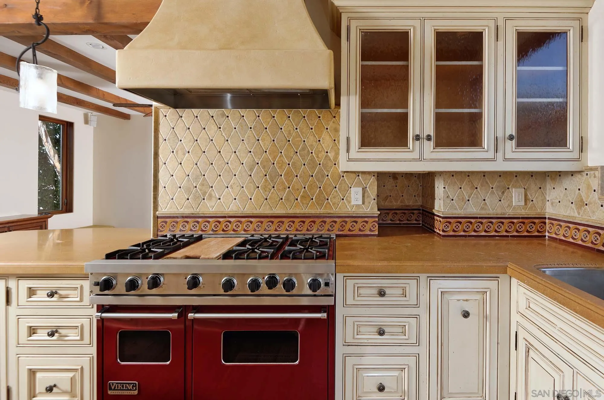 1908 Hypatia Way La Jolla, CA 92037 - Photo 12 of 29 a kitchen with granite countertop a stove and a sink
