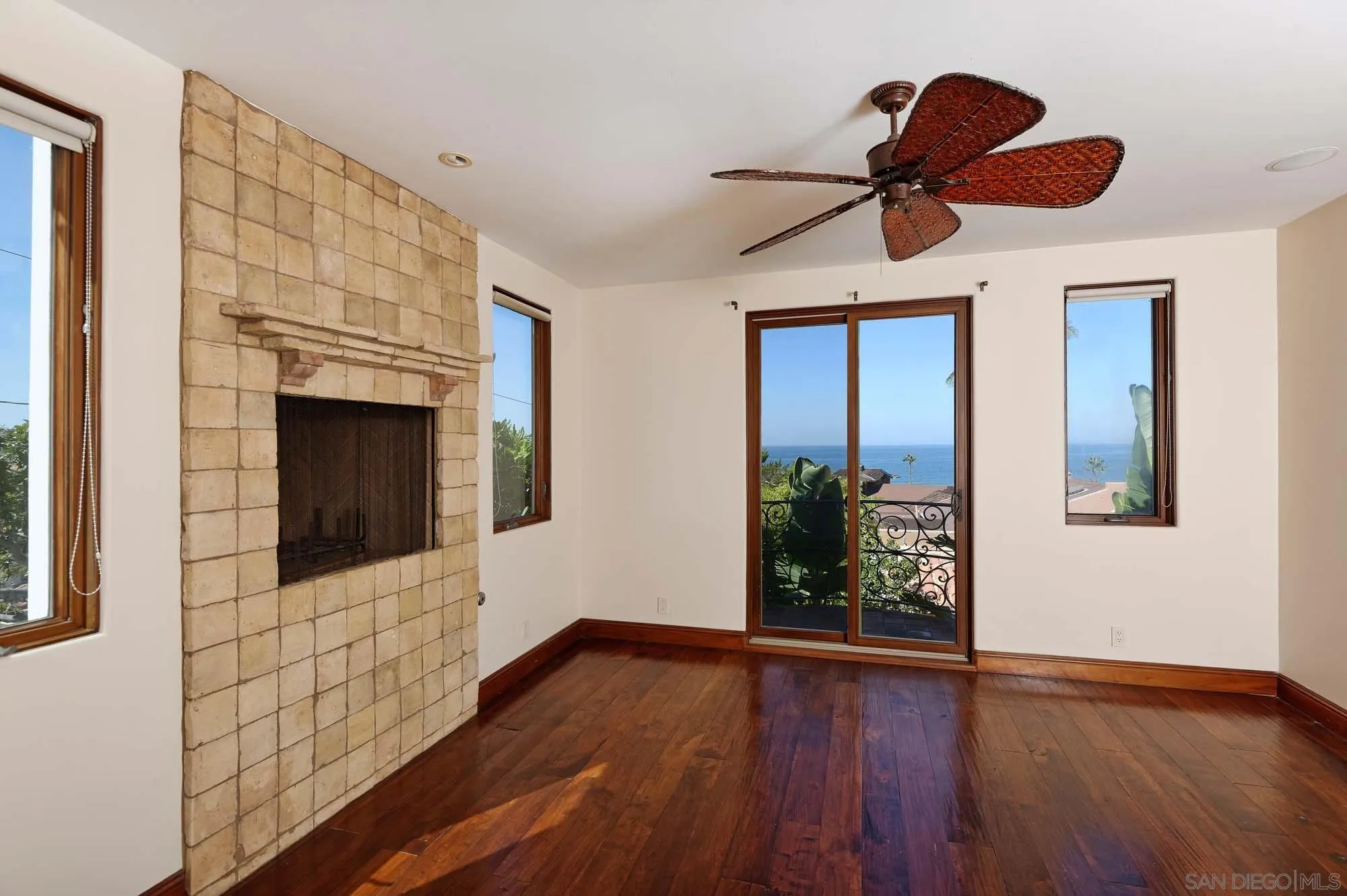 1908 Hypatia Way La Jolla, CA 92037 - Photo 17 of 29 a view of a livingroom with wooden floor a ceiling fan and window