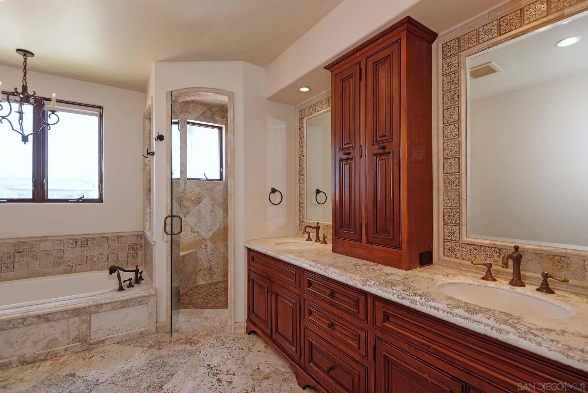 1908 Hypatia Way La Jolla, CA 92037 - Photo 19 of 29 a spacious bathroom with a granite countertop tub sink and mirror