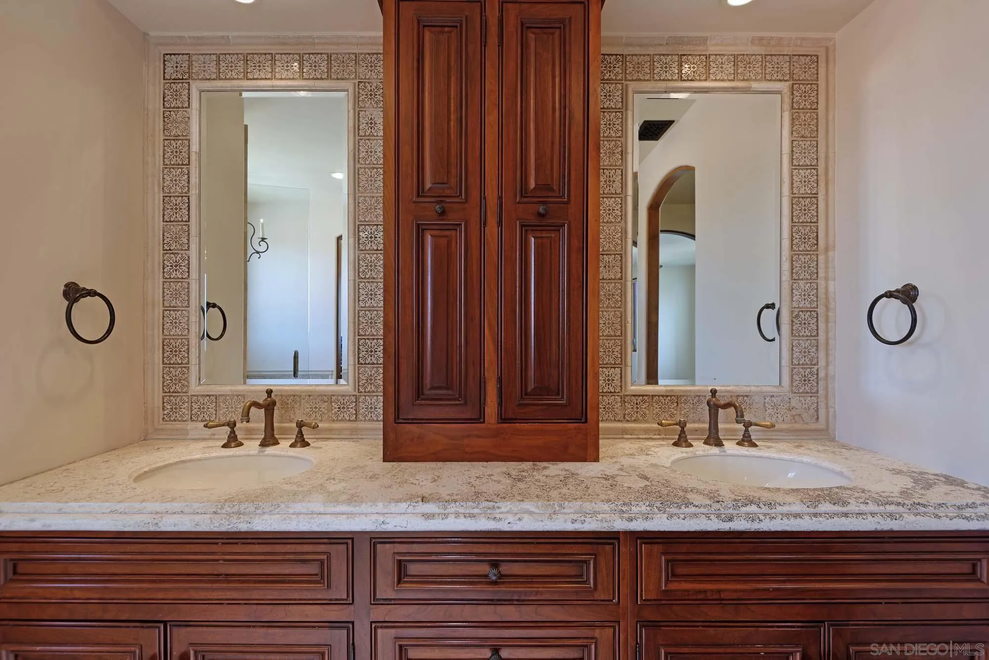 1908 Hypatia Way La Jolla, CA 92037 - Photo 20 of 29 a bathroom with a granite countertop sink and a mirror