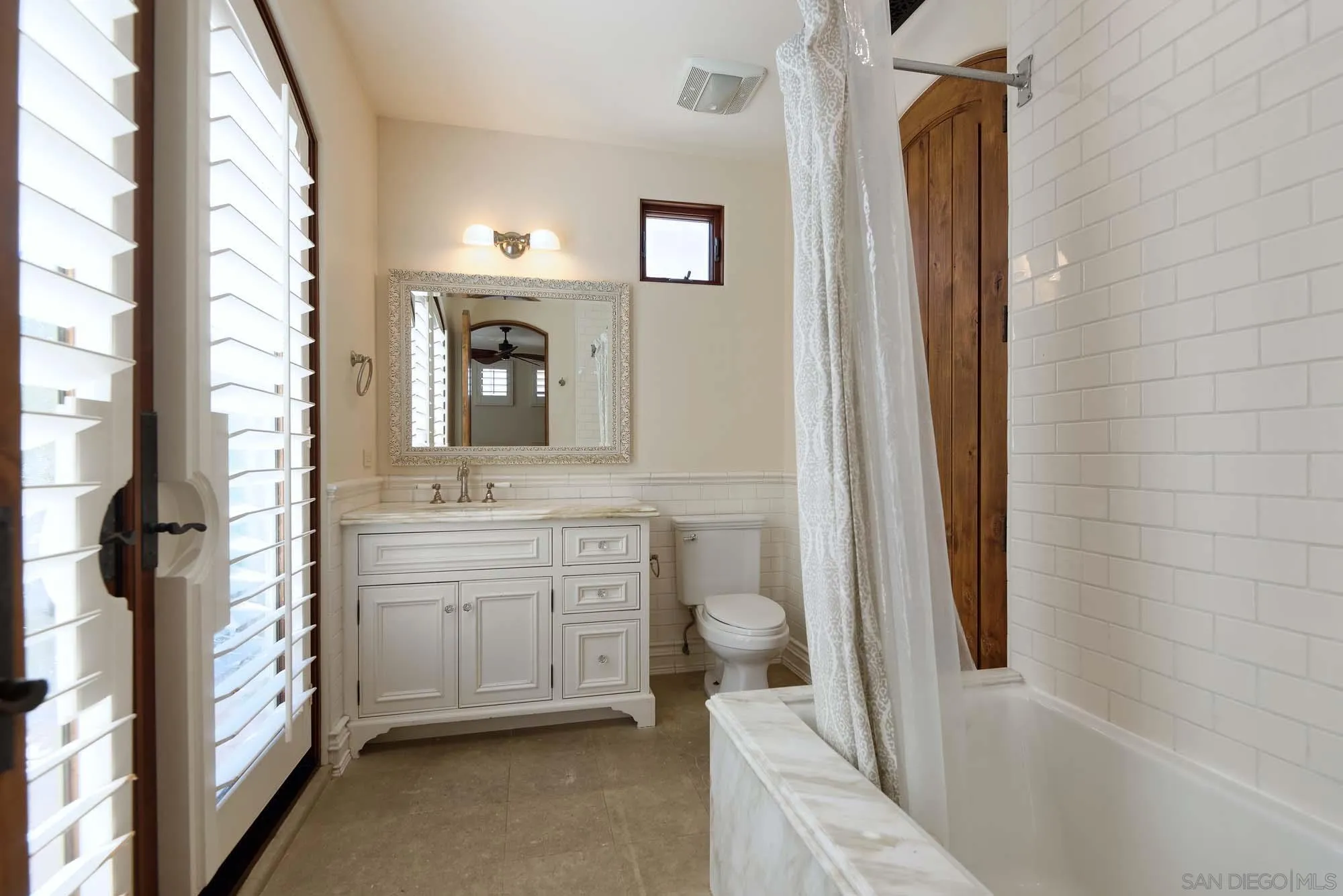 1908 Hypatia Way La Jolla, CA 92037 - Photo 22 of 29 a bathroom with a sink a toilet and a mirror