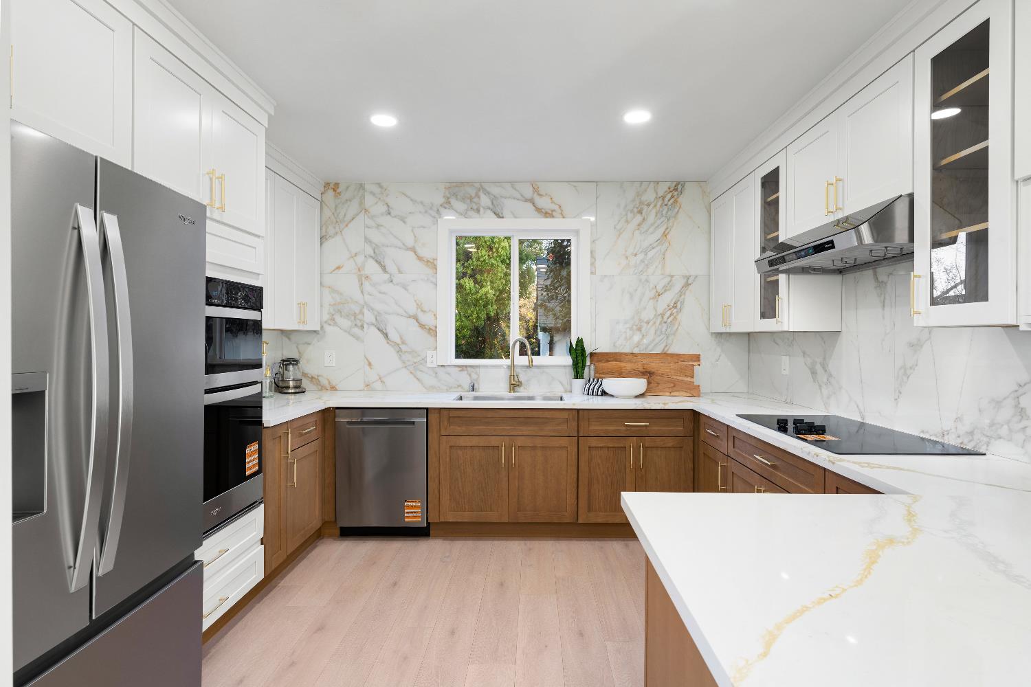5401 J Street Sacramento, CA 95819 - Photo 19 of 71 a large kitchen with stainless steel appliances granite countertop a refrigerator and a sink