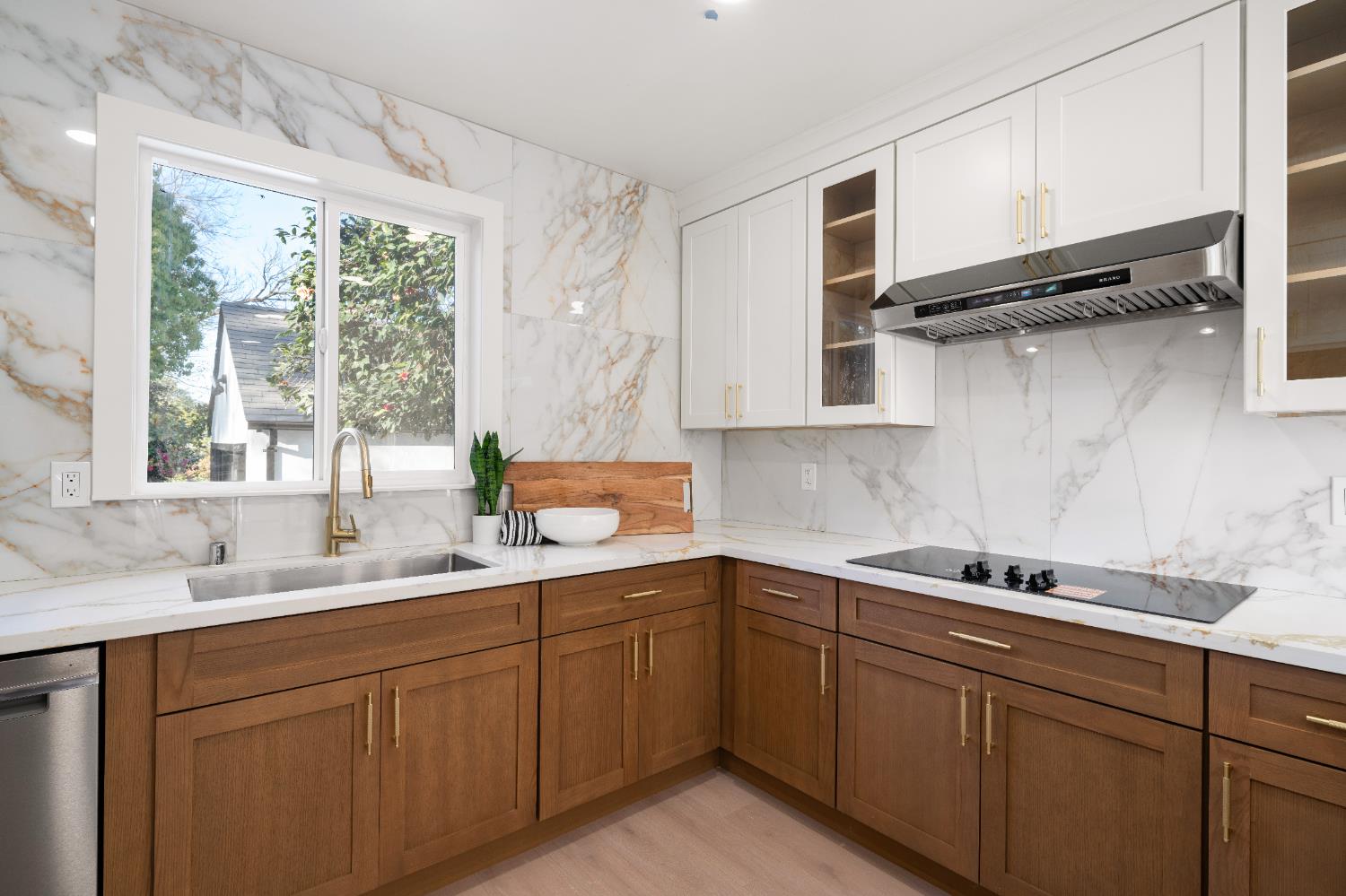 5401 J Street Sacramento, CA 95819 - Photo 22 of 71 a kitchen with a sink and cabinets