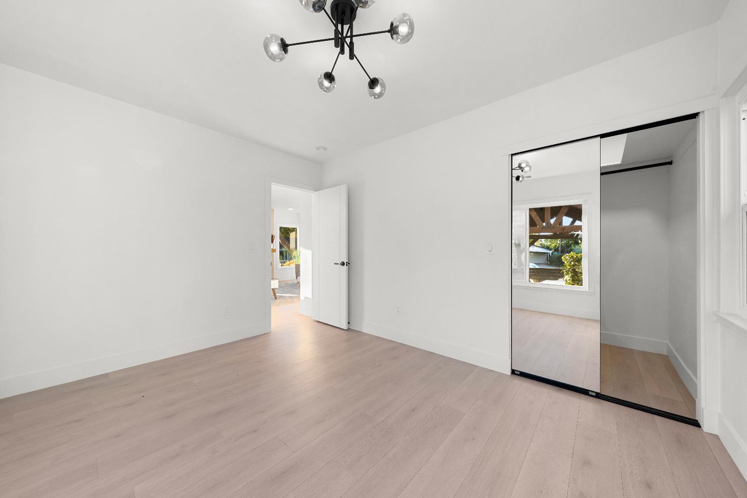 5401 J Street Sacramento, CA 95819 - Photo 24 of 71 a view of an empty room with closet and a window