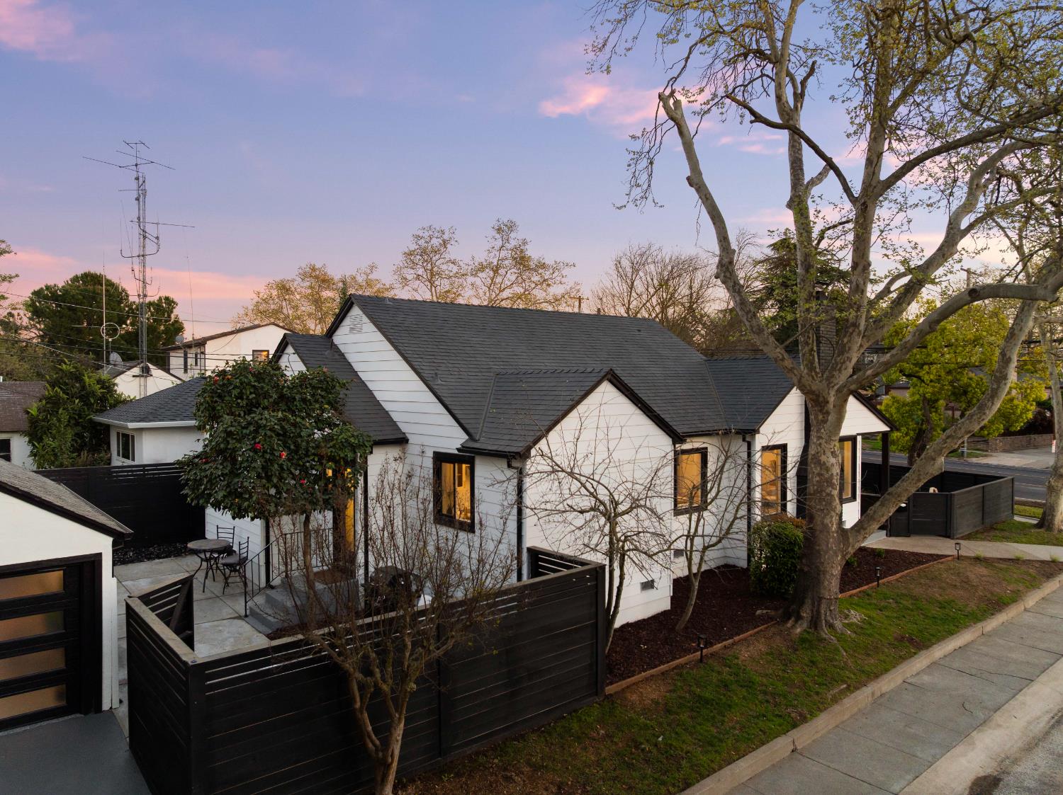 5401 J Street Sacramento, CA 95819 - Photo 61 of 71 a front view of a house with a yard