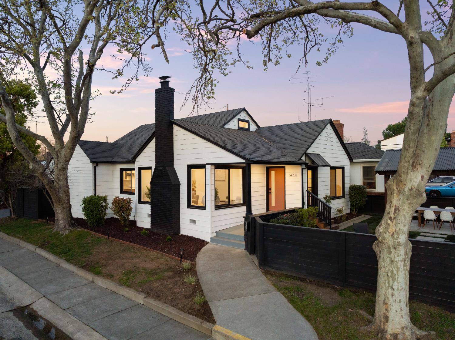 5401 J Street Sacramento, CA 95819 - Photo 67 of 71 a front view of a house with a yard