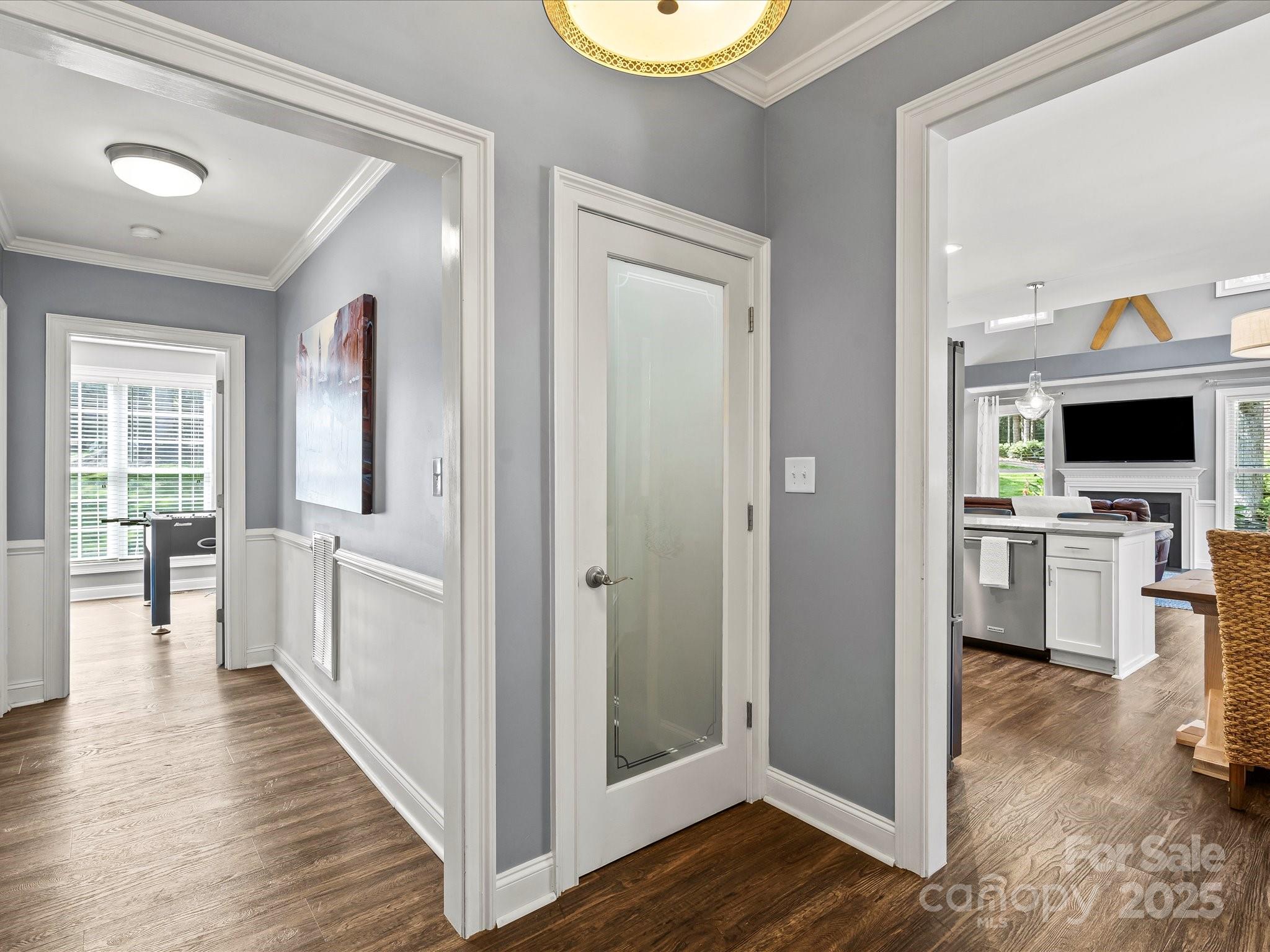 172 Beaten Path Road Mooresville, NC 28117 - Photo 14 of 48 a view of a kitchen with a sink and dishwasher with wooden floor