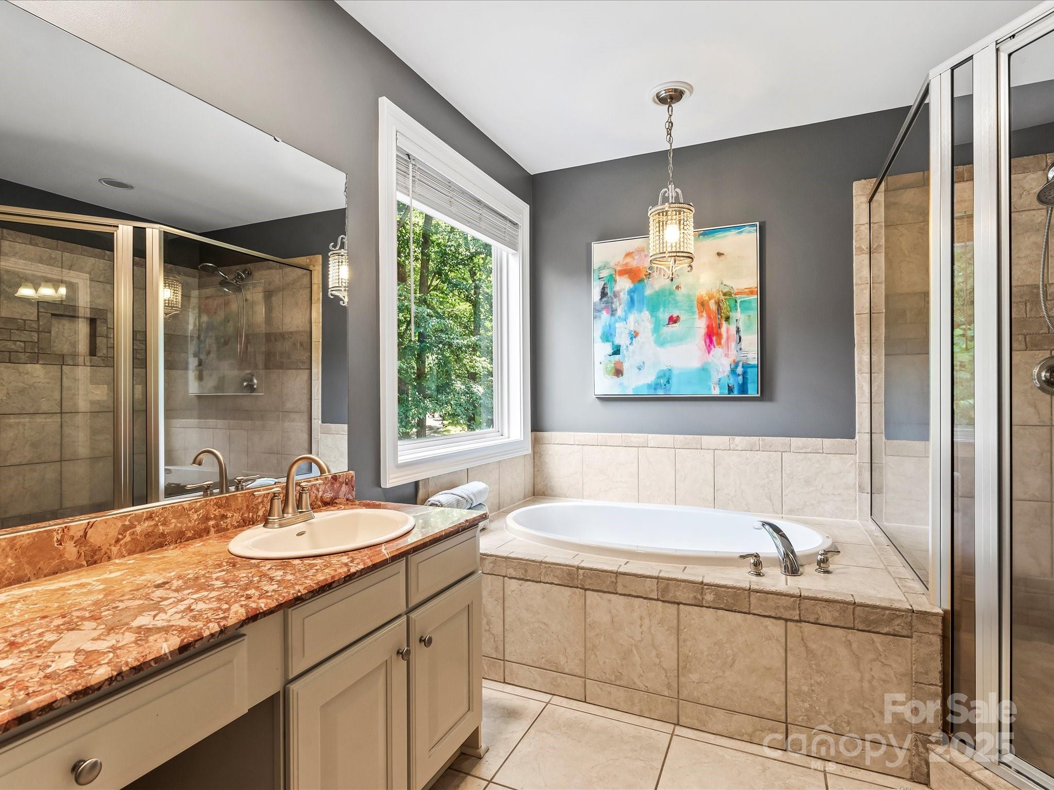 172 Beaten Path Road Mooresville, NC 28117 - Photo 18 of 48 a bathroom with a granite countertop sink mirror and bathtub