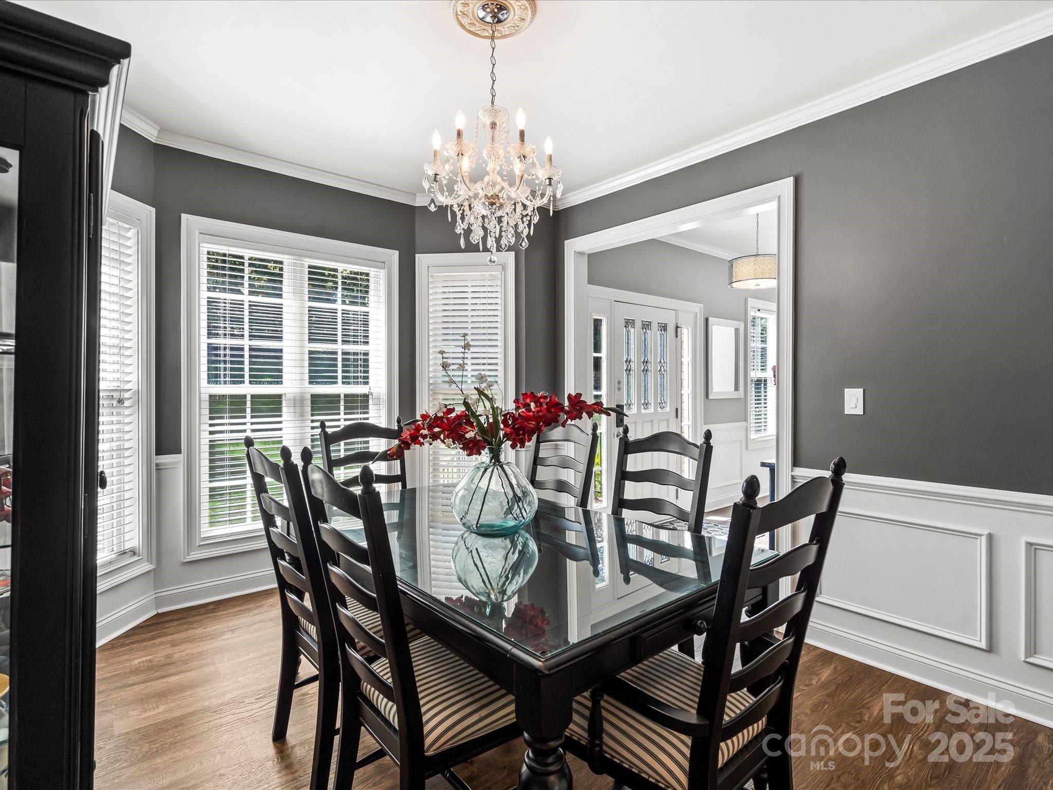 172 Beaten Path Road Mooresville, NC 28117 - Photo 23 of 48 a view of a dining room with furniture window and wooden floor