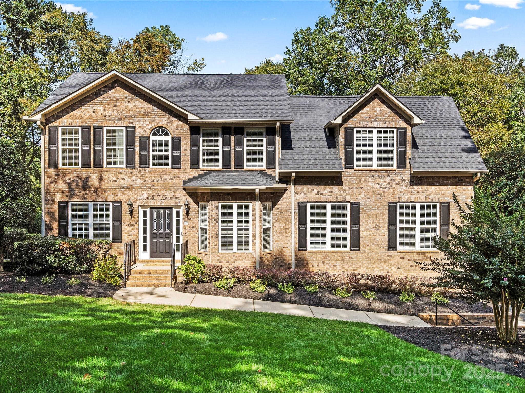 172 Beaten Path Road Mooresville, NC 28117 - Photo 3 of 48 a front view of a house with a yard and trees