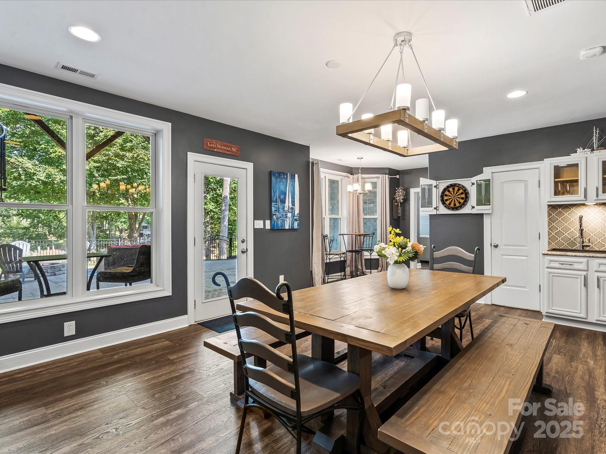 172 Beaten Path Road Mooresville, NC 28117 - Photo 34 of 48 a view of a dining room with furniture window and wooden floor