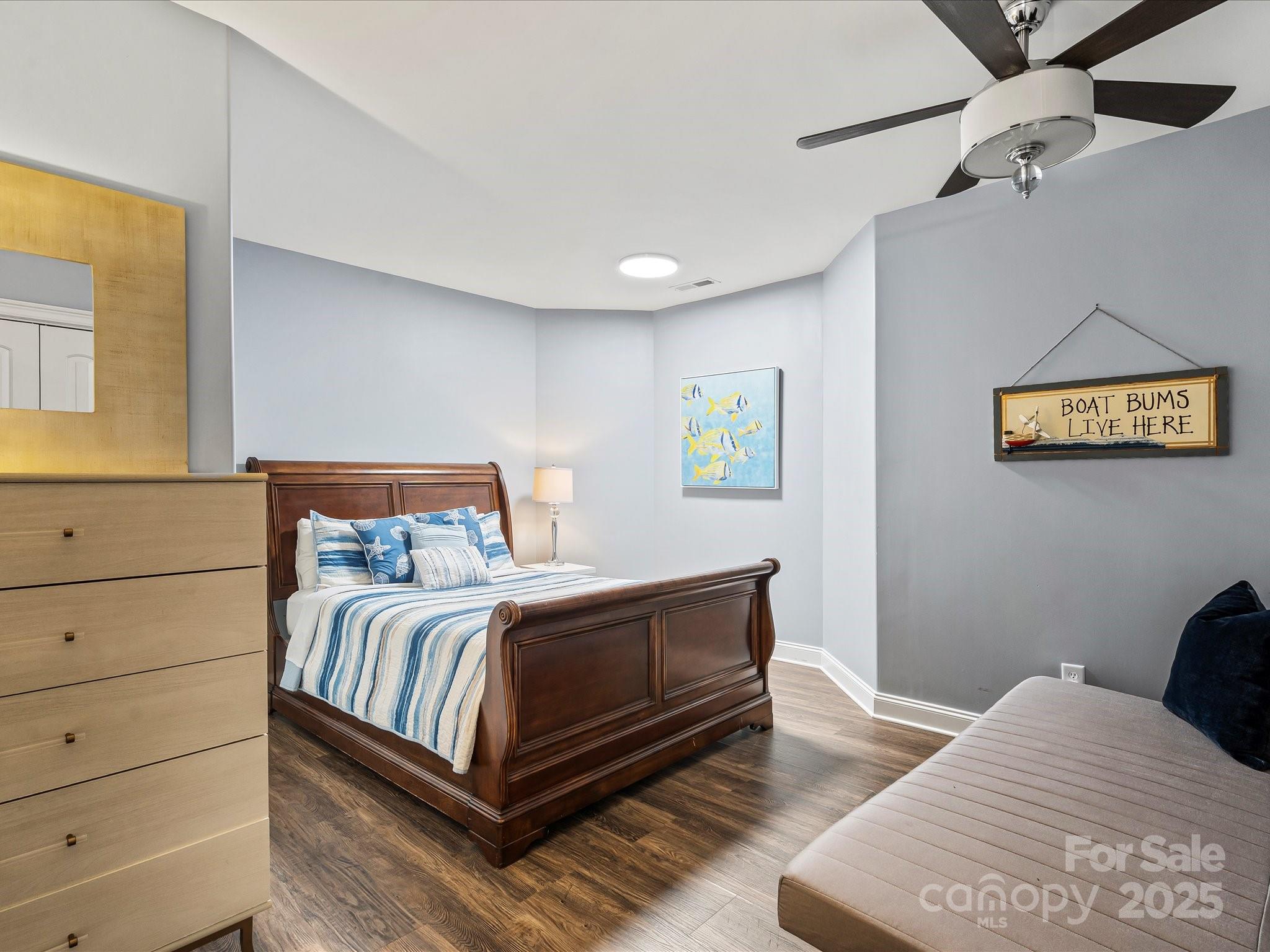 172 Beaten Path Road Mooresville, NC 28117 - Photo 37 of 48 a bedroom with a bed and painting on the wall