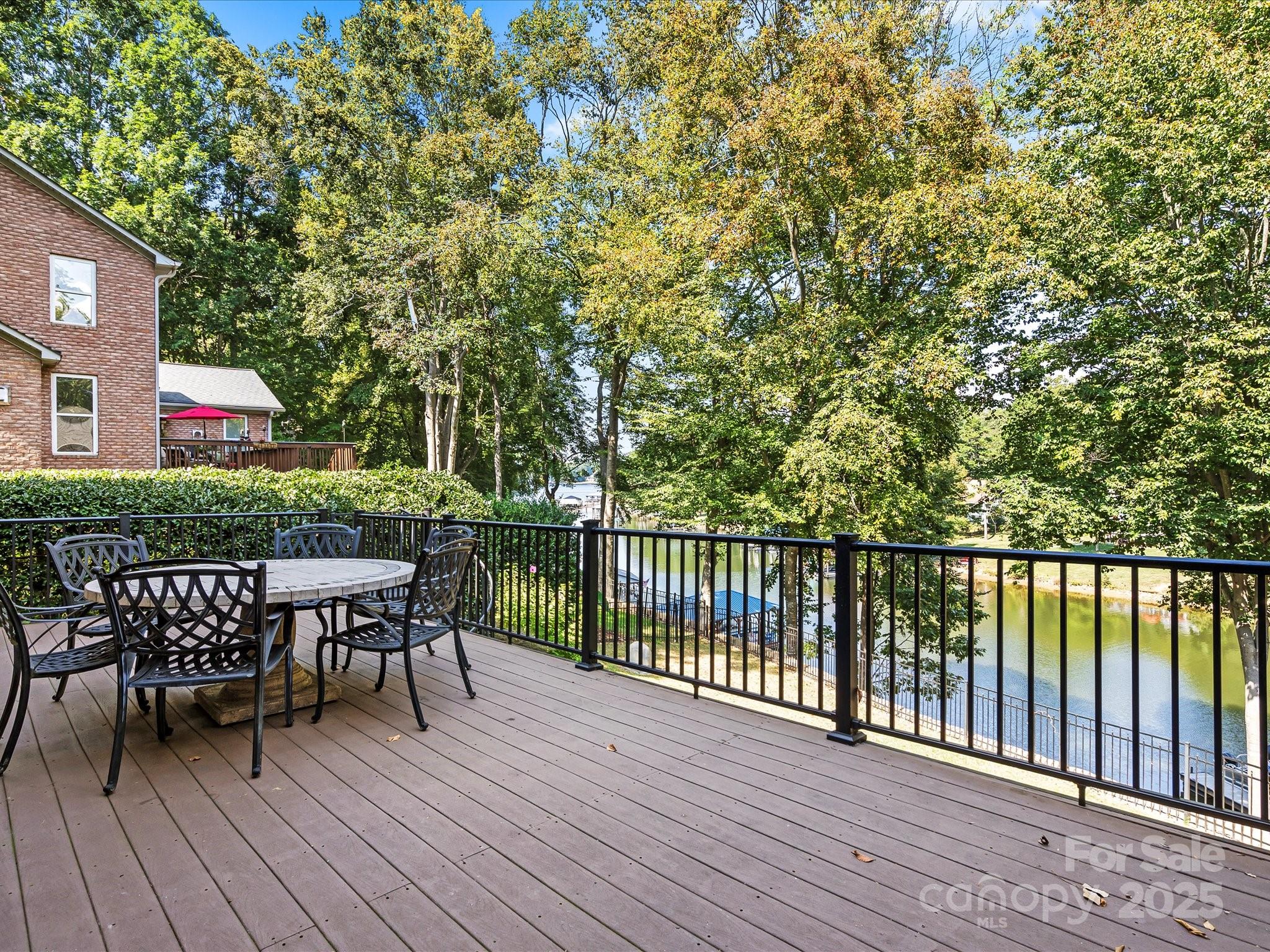 172 Beaten Path Road Mooresville, NC 28117 - Photo 39 of 48 a view of a deck with table and chairs and wooden floor