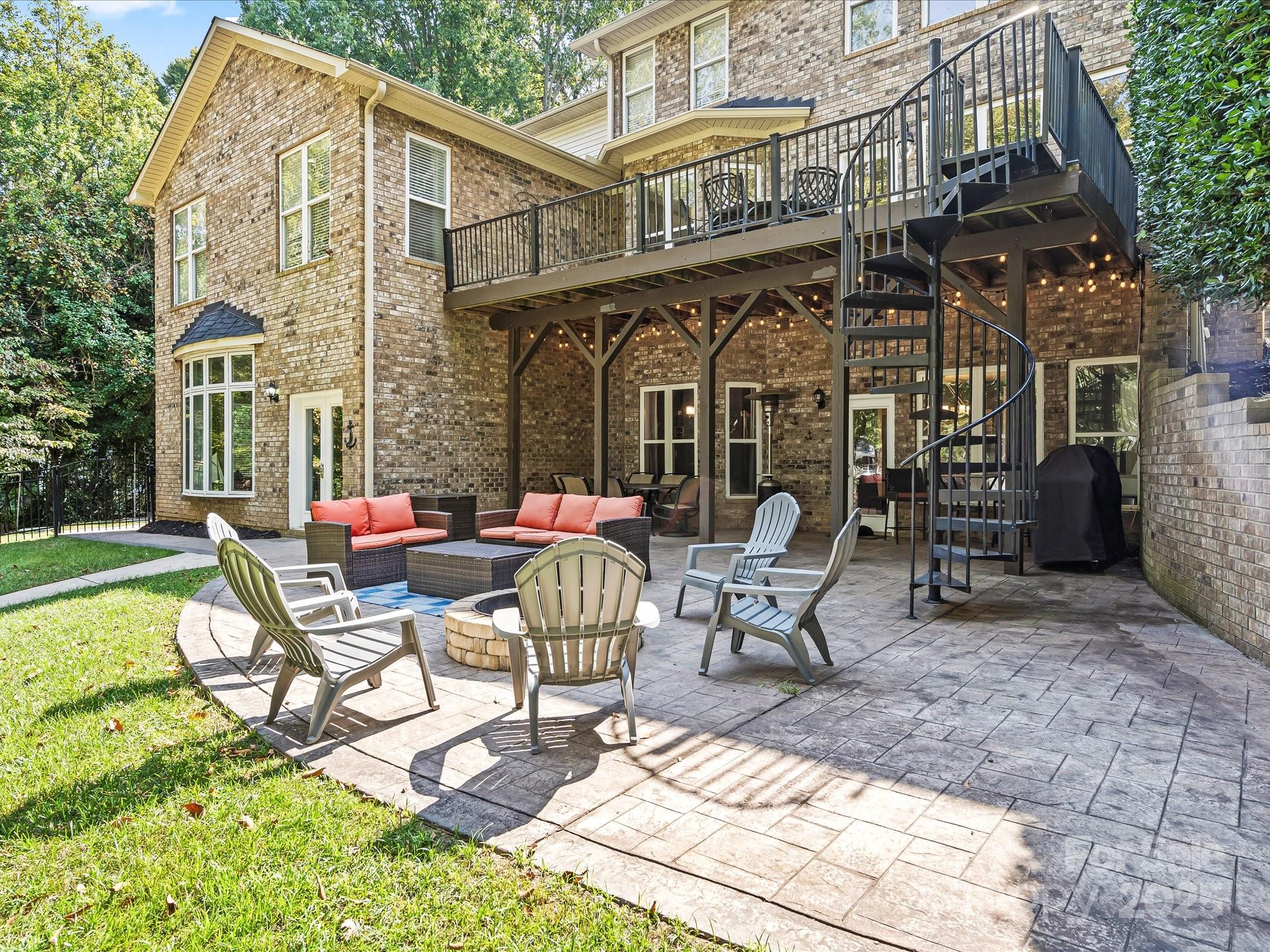 172 Beaten Path Road Mooresville, NC 28117 - Photo 40 of 48 a view of a patio with a table and chairs