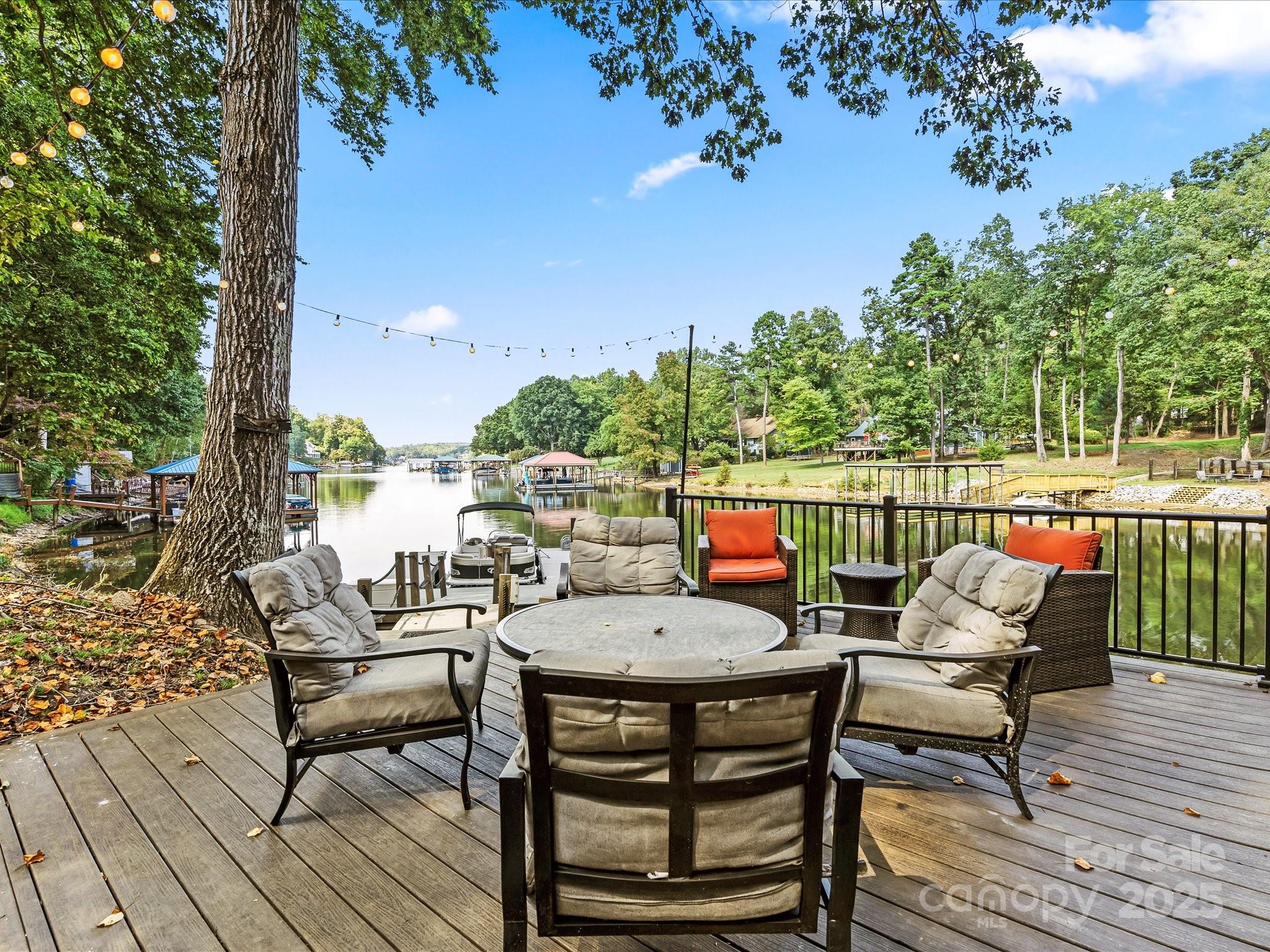 172 Beaten Path Road Mooresville, NC 28117 - Photo 42 of 48 an outdoor sitting area with furniture and wooden floor