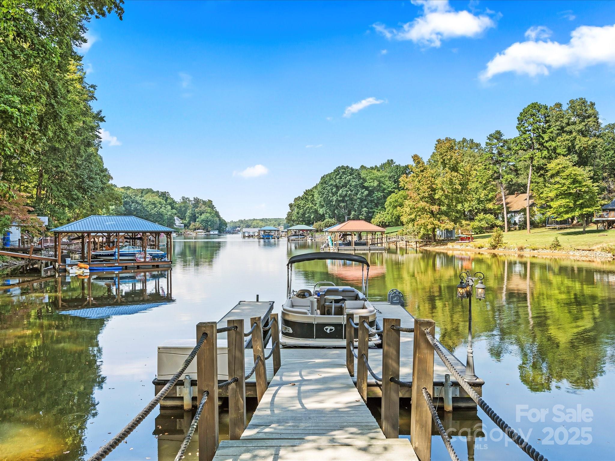 172 Beaten Path Road Mooresville, NC 28117 - Photo 43 of 48 a view of a lake with a patio