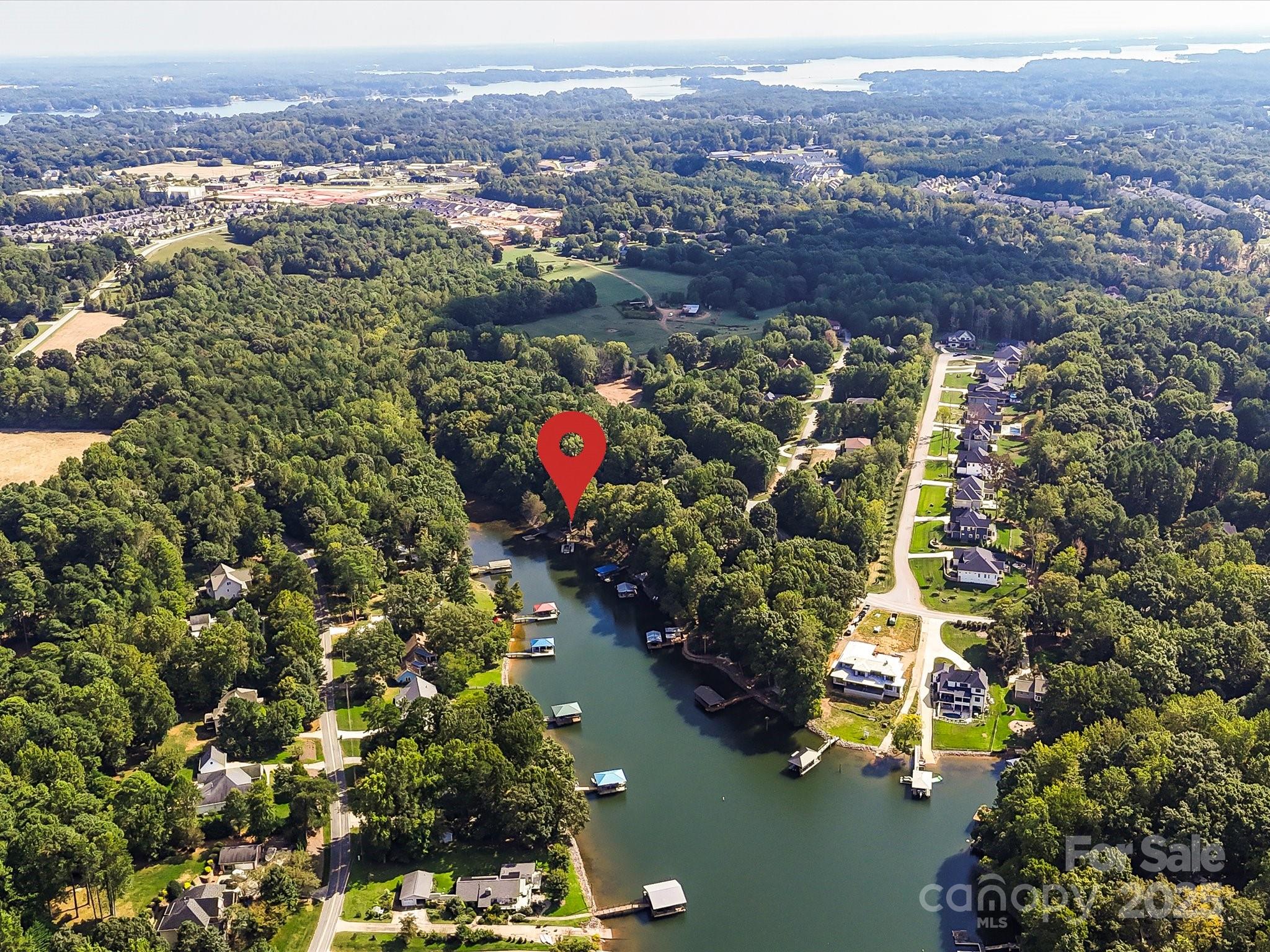 172 Beaten Path Road Mooresville, NC 28117 - Photo 47 of 48 an aerial view of a houses with a lush green forest