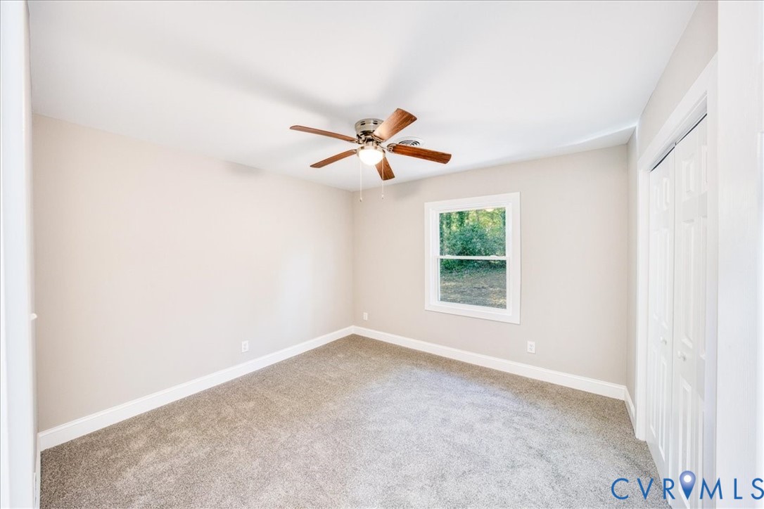 3600 Sherbrook Road Richmond, VA 23235 - Photo 16 of 26 an empty room with a window and a ceiling fan