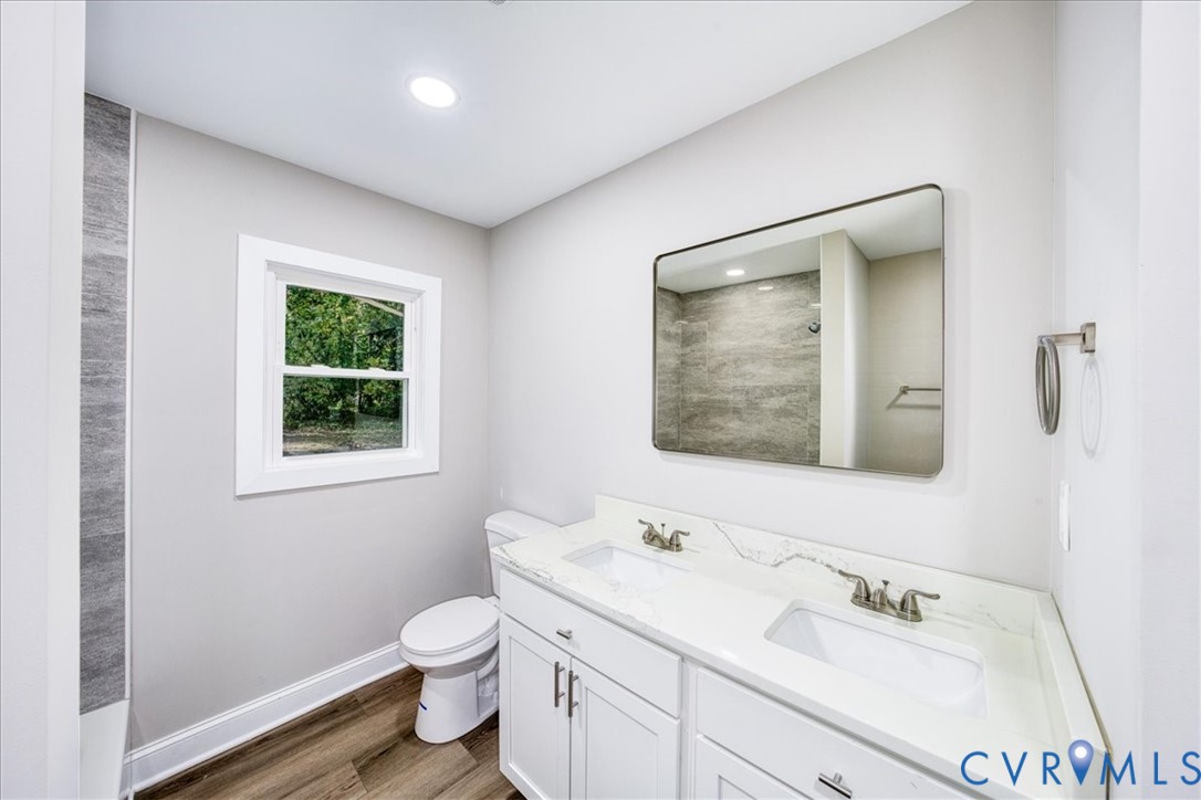3600 Sherbrook Road Richmond, VA 23235 - Photo 18 of 26 a bathroom with a toilet sink and mirror