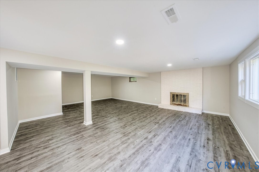 3600 Sherbrook Road Richmond, VA 23235 - Photo 23 of 26 an empty room with wooden floor and windows
