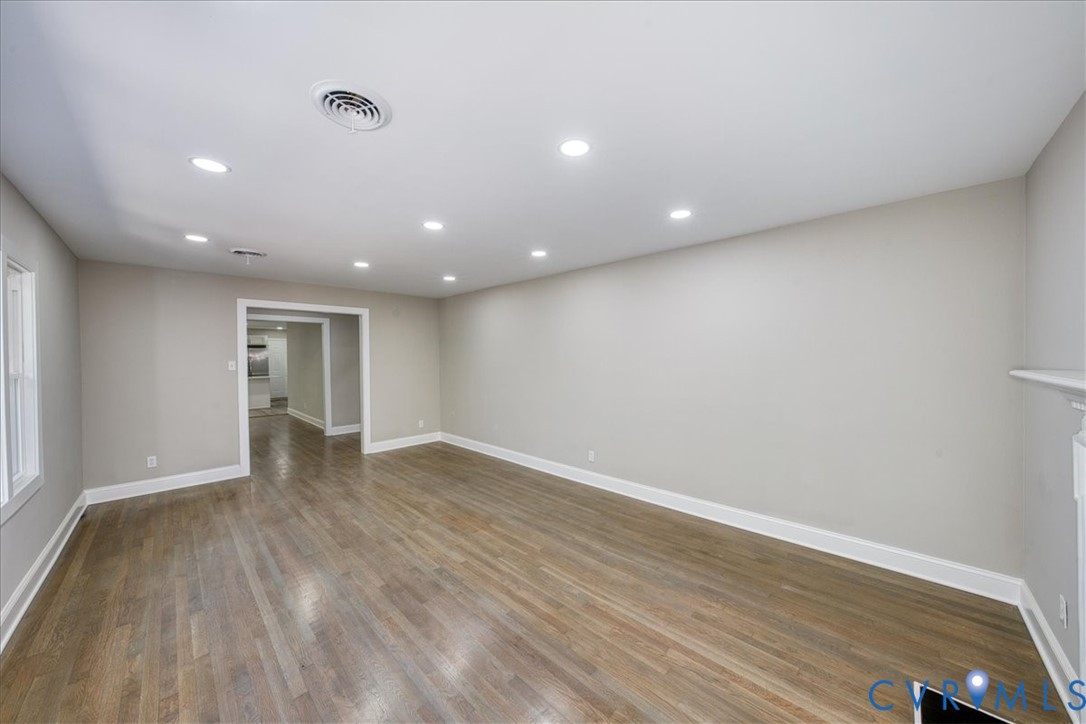 3600 Sherbrook Road Richmond, VA 23235 - Photo 6 of 26 a view of an empty room with wooden floor and a window