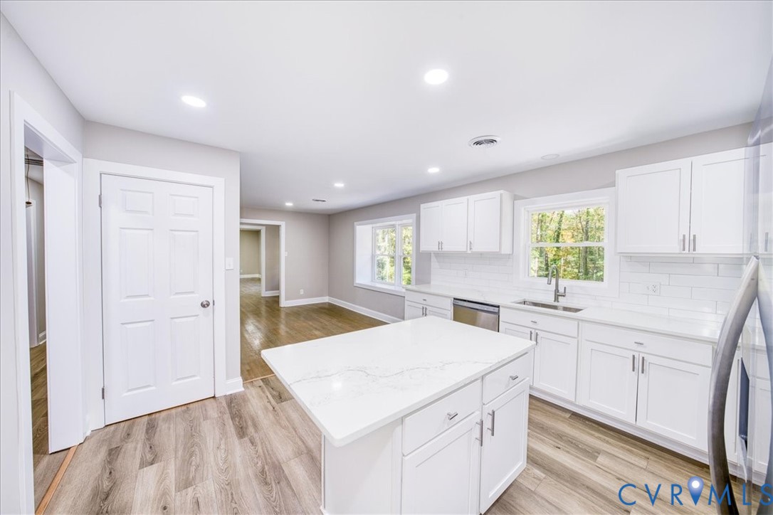 3600 Sherbrook Road Richmond, VA 23235 - Photo 10 of 26 a kitchen with a sink a stove cabinets and a refrigerator