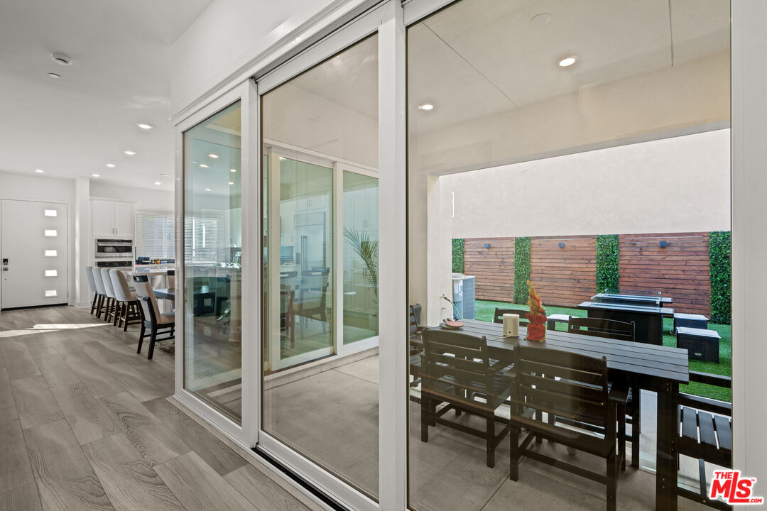 26710 Beartown Lane Stevenson Ranch, CA 91381 - Photo 5 of 21 a view of a dining room with furniture window and wooden floor
