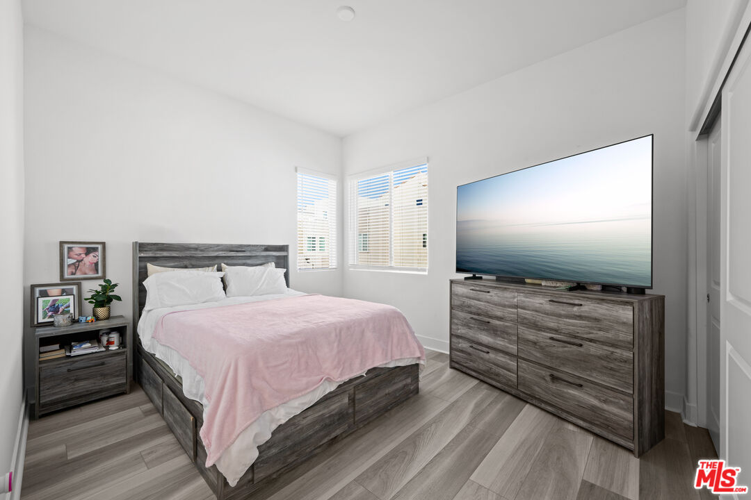 26710 Beartown Lane Stevenson Ranch, CA 91381 - Photo 10 of 21 a bedroom with a bed and a flat screen tv